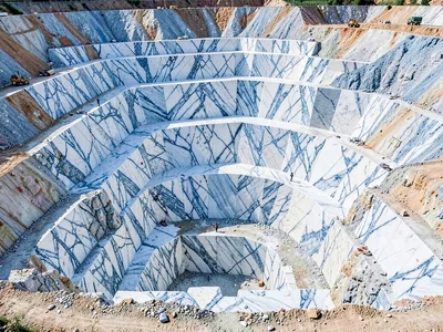 Fresh quarry cut showing blue-white crystalline marble surface