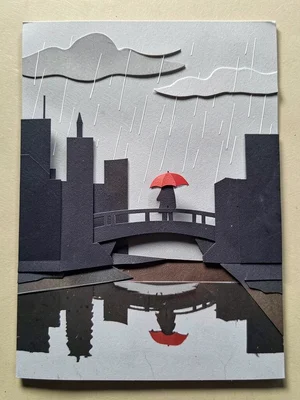 A rainy day city: grey sky with rain cut-outs, building silhouettes, a figure wi