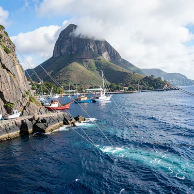 Cape Town mountain-sea duality, Table Mountain backdrop, fishing boats moored in