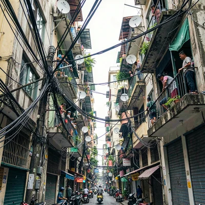 Documentary photograph of megacity life, dense urban scene, A narrow alley betwe