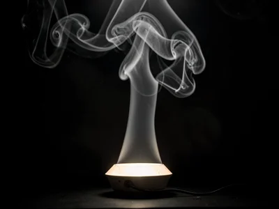 Heat rising from lamp creating continuous convection