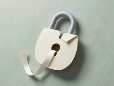 Soft 3D papercraft padlock the size of a melon, half open, with a coiled paper r