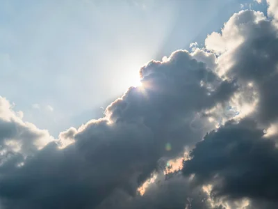 Translucent cloud revealing sun position as diffuse glow