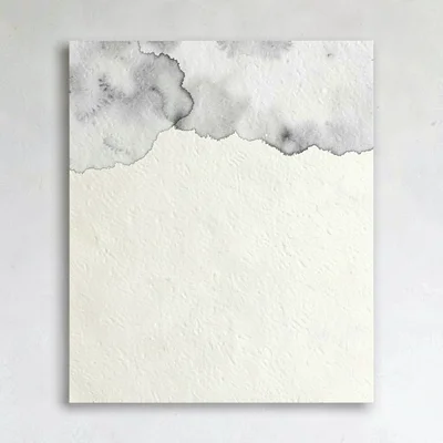 Quote card with a faint watercolor wash of grey along the top edge, deep cream b