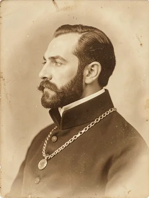 A Victorian gentleman's profile portrait — high collar, watch chain, formal comp