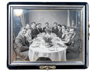 Daguerreotype-style family dinner scene, formal harvest feast, silver tones