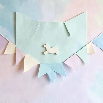 Cut-paper banner of a paper studio backdrop with a tiny rocker silhouette, mint 
