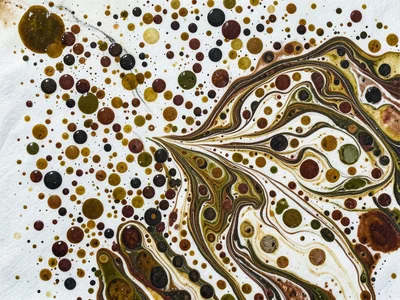 Stone marbling pattern, dense random drops of multiple earth-tone pigments cover
