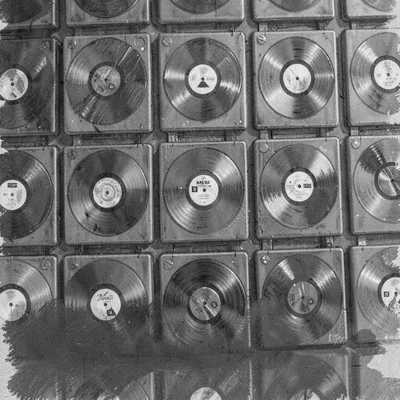 Charcoal of a wall of LPs displayed face-out, soft darks pooling at the edges