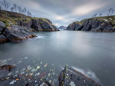 Rocky archipelago with smooth water filling between