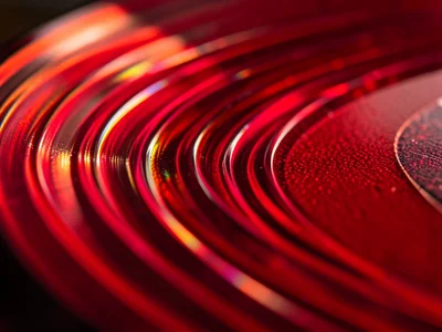 Colored vinyl extreme macro, translucent red vinyl with light passing through be