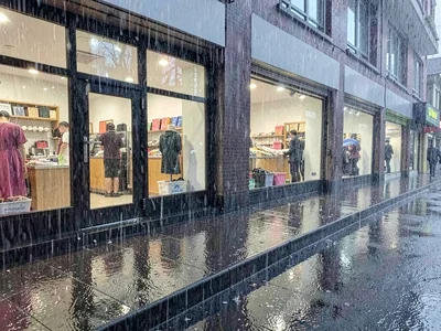 Rain reflected in shop windows