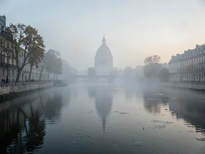 Distant dome suggestion through clearing mist