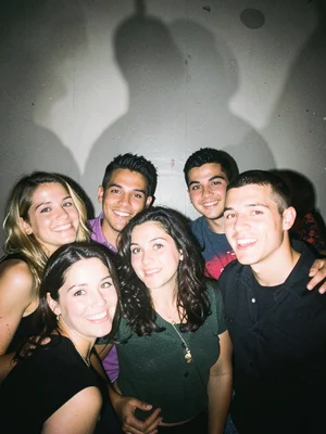 Friends cramped in a photo booth