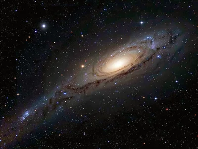 Galaxy tail stretched by gravitational interaction