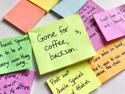 Sticky note on sleeping partner: "Gone for coffee, back soon," the gentle wake-u