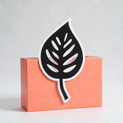 Sticker design study of a stylised fenestrated leaf silhouette on a punchy coral