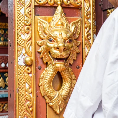 Lanna temple detail, Chiang Mai sacred ornament, intricate gold temple door knoc
