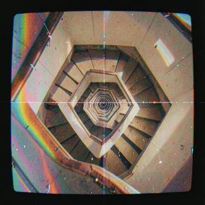 A stairwell viewed from above, the geometric spiral warped by magnetic damage