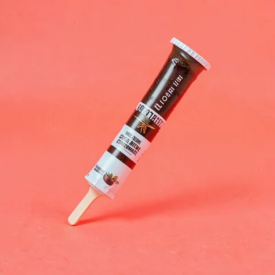 single foil-stick of single-serve cold-brew-coffee-concentrate at slight tilt on
