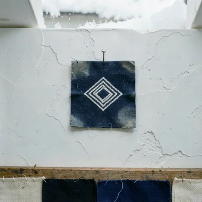 Documentary-style photograph, intimate and close, northern Japanese textile work