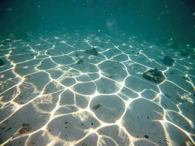 Caustic pattern intensity variation with depth from surface