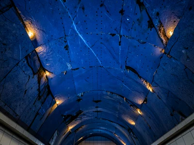 The raw rock ceiling of a Stockholm Tunnelbana station, natural granite blasted 
