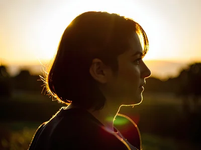 Hair backlit creating golden aureole