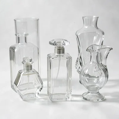 Empty perfume bottles, decorative glass forms, vessel aesthetics