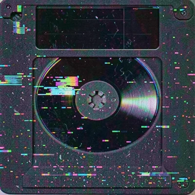 Floppy disk shutter open revealing magnetic platter surface, read window
