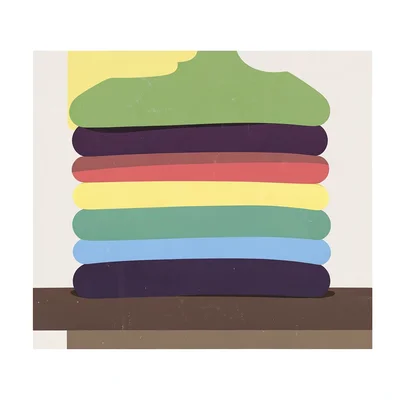 Stack of folded sweaters on a shelf, each a different flat opaque color