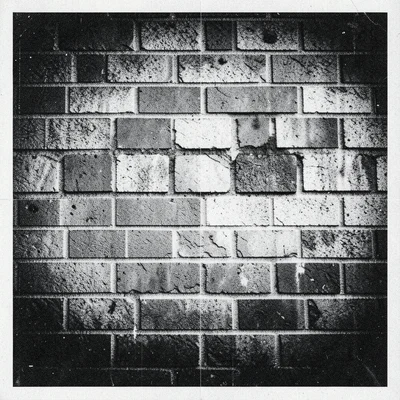 Photocopy of a brick wall, regular pattern degrading into irregular checkerboard
