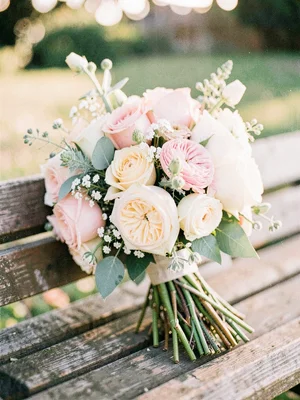 Wedding bouquet on a wooden bench