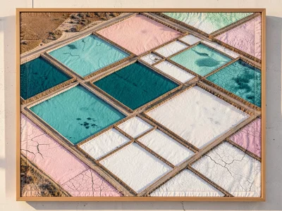 A salt flat evaporation pond complex from above, geometric rectangular ponds in 