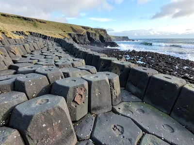 Hexagonal columns at Reynisfjara beach in row