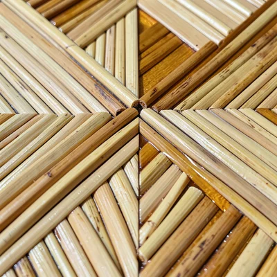 Close-up of a straw marquetry surface where straws are laid at different angles 