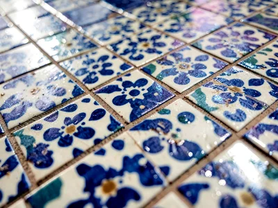 Tilework catching light at angle revealing texture
