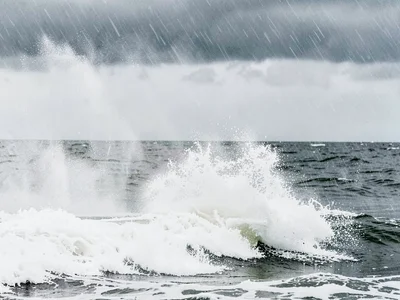 Spray interaction with rain