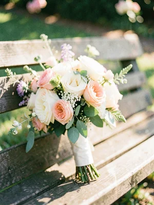 Wedding bouquet on a wooden bench