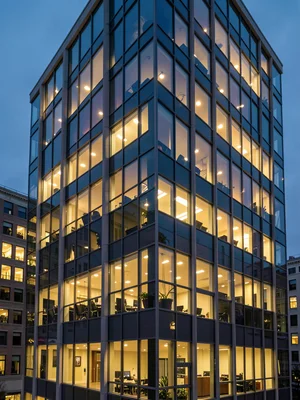 Office building windows lit