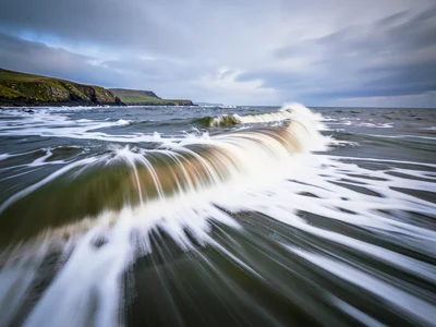 Wave surge leaving trails of dissolved motion