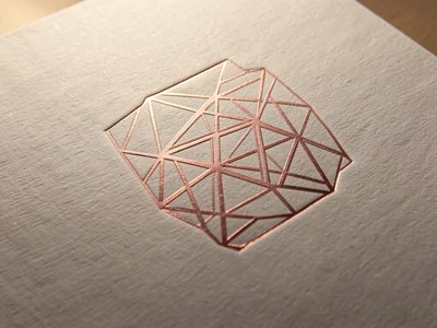 Rose gold foil geometric pattern stamped over subtle blind emboss, foil sitting 