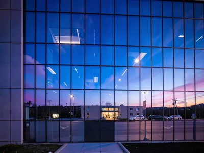 Blue hour building glowing with sky color