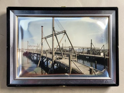 Industrial pier in summer light, metal structures, antiqued photographic feel
