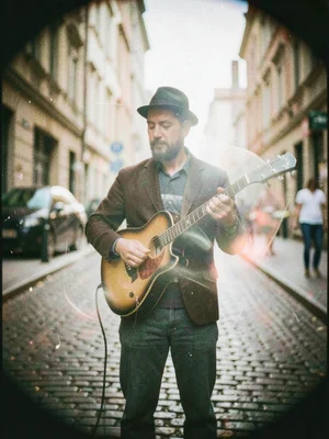 Street musician in motion, Holga rendering them as a soft ghost making music, im