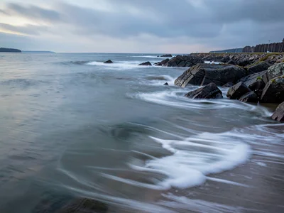 Incoming tide as gradual soft encroachment