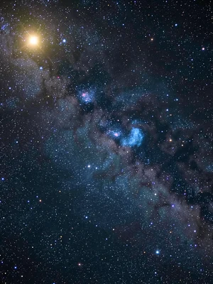 A reflection nebula — blue-lit cloud of dust reflecting a nearby hot star, the s