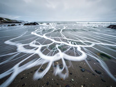 Foam pattern blurred into trailing white streaks
