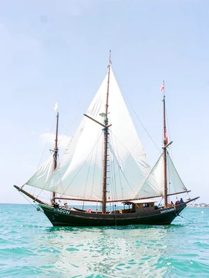 Brilliant Indian Ocean noon light in Dar es Salaam, Three dhow masts creating tr