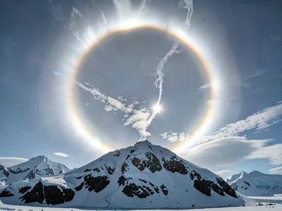 Solar halo against arctic mountain backdrop